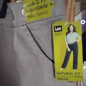 Size 22W Lee Women's Straight Leg Trouser Jeans in Oatmeal Rinse Color.
